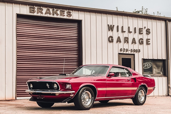 1969 Mustang Mach 1 -This Mustang is restored to factory new condition with Candyapple Red paint, 390-4V engine, 4-speed transmission, Dark Red Mach 1 interior and Shaker Hood Scoop. With its rare options, it is a “one of one” Mustang.