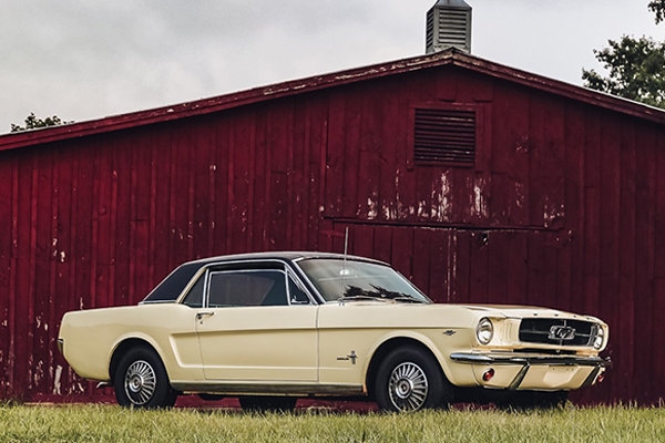 1965 Mustang Coupe - This Springtime Yellow with Black Vinyl Top Mustang has been in the same family since purchased new in April, 1965. It is in excellent condition and has a 289-2V engine, C-4 automatic transmission, factory air conditioning and a rare front bench seat.